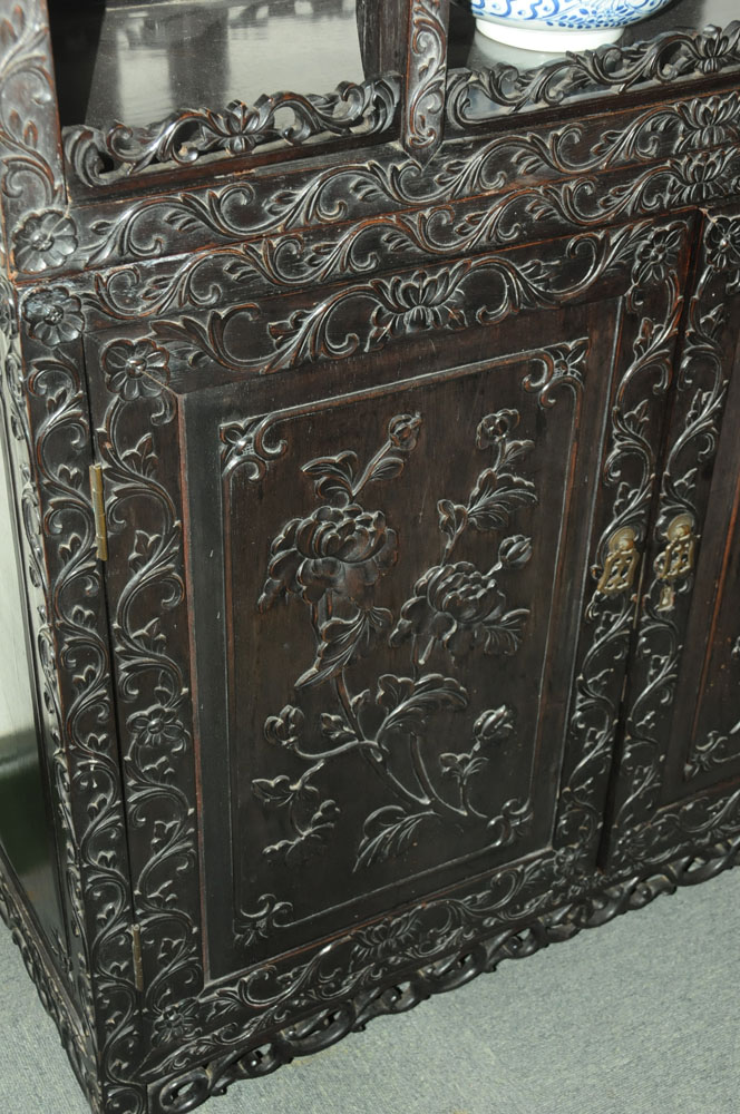 A 19th century Chinese hardwood cabinet in two sections, - Image 10 of 18