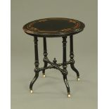 A Victorian ebonised and inlaid circular table,