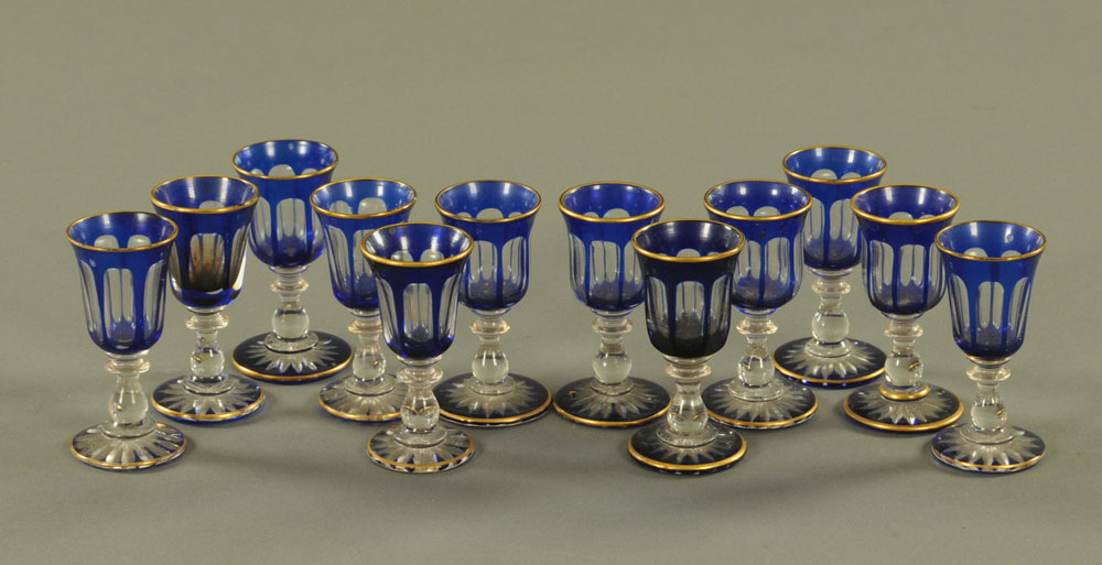 A set of twelve Edwardian blue flash liqueur glasses. Height 8.5 cm.