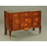 A 19th century continental marble topped commode chest of three drawers,