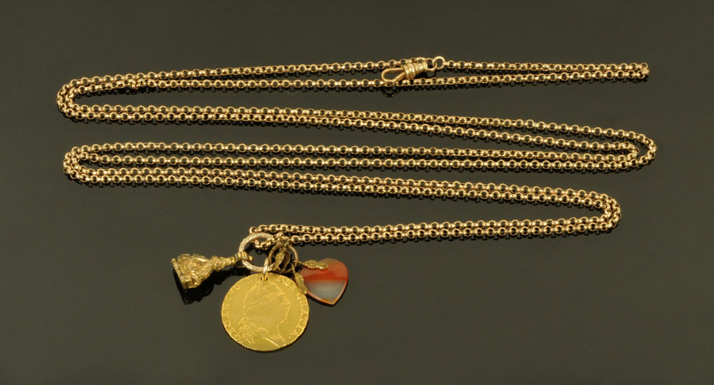 A George III 1794 gold spade guinea, sold together with a Victorian 9 ct gold muff chain,