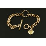A 9 ct gold chain bracelet and wedding band, with heart charm, 11.7 grams.