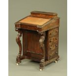 A Victorian figured walnut Davenport,