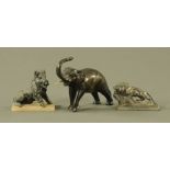 A bronze model of an elephant, together with a spelter boar and lion. Tallest 15 cm.