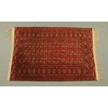 An Eastern fringed rug,