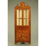 A 19th century foliate and bird marquetry Dutch corner cabinet,