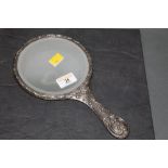 A silver mounted hand mirror