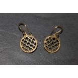 A pair of yellow metal lattice pattern earrings