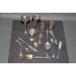 Group of miscellaneous silver, napkin rings, spoons, butter knives etc,