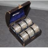 A cased set of six silver napkin rings, Chester hallmarks,