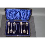 A cased set of 6 silver teaspoons with sugar tongs