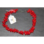 A decorative stained coral necklace