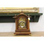An Edwardian walnut bracket clock