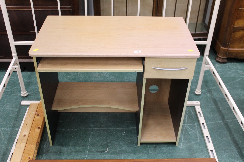 A modern beech effect computer desk with slide out tray