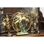 Four deco style figural ornaments all approximately 36 cm high