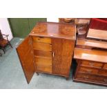 Walnut cabinet opening to a fitted interior with two short and four long drawers