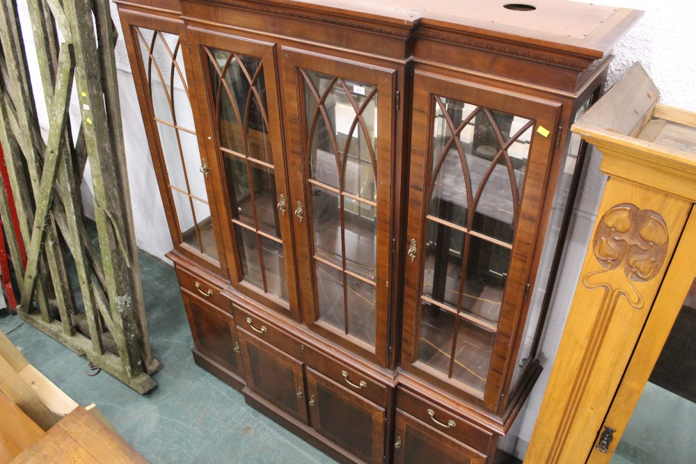 Ethan Allen, a breakfront mahogany display cabinet.