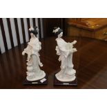 Pair of ornamental figurines, 33 cm high.