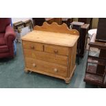A Victorian pine 2/2 chest of drawers with rear upstand.