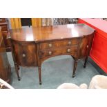 G T Rackstraw Worcester, a breakfront mahogany sideboard with two central drawers and cupboards,