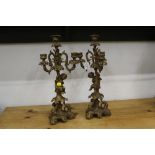 Two gilt metal three branch candelabras