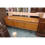 New Charm furniture, a sideboard comprising three drawers and three cupboards.