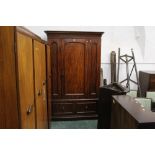 Victorian mahogany wardrobe with large central door above one large drawer with turned wooden
