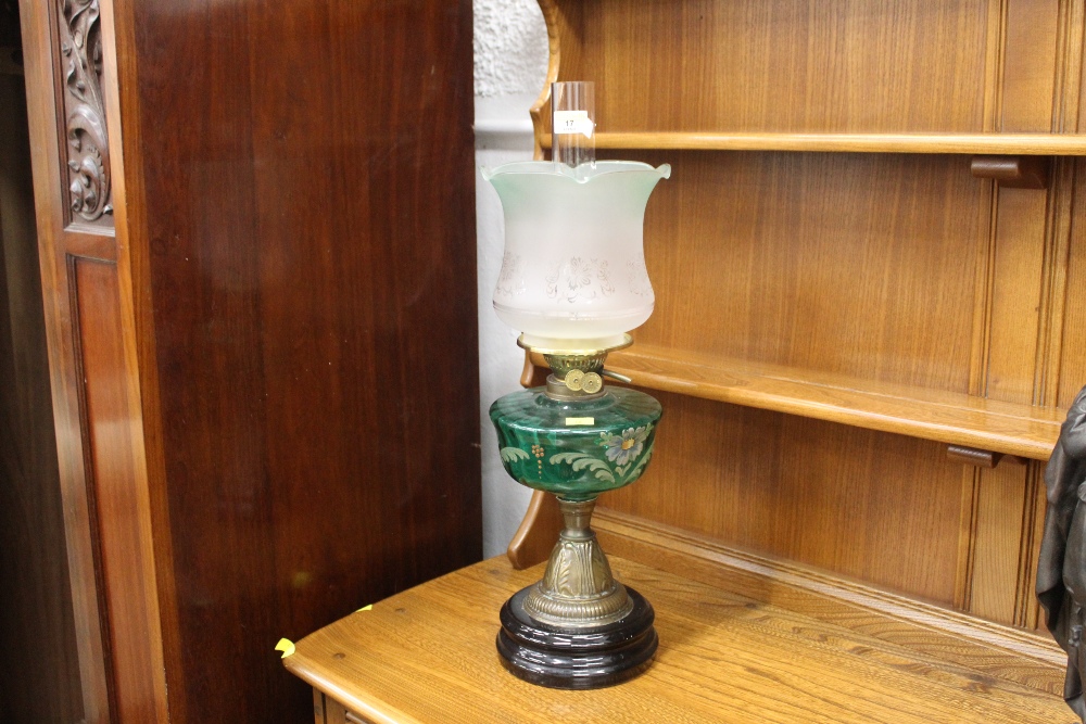 Converted Victorian lamp with green glass painted reservoir, chimney and shade, +/- 59 cm high.