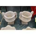 A pair of urn garden planters,