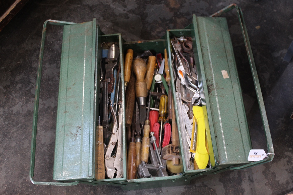 Green foldout toolbox and tools, wood chisels, pliers, spanners, scribe etc.