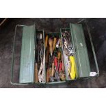 Green foldout toolbox and tools, wood chisels, pliers, spanners, scribe etc.