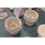 A pair of concrete garden planters,