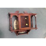 An Edwardian mahogany wall hanging glazed display, length 55 cm, width 67 cm, depth 21 cm.