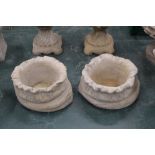 A pair of sack effect planters,