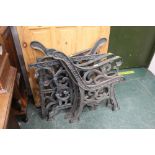 Two pairs of cast iron bench ends and pair of cast iron table legs
