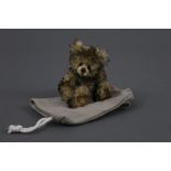 A soft plush Charlie Bears "Minimo Collection" teddy bear, named "Tawnie", 18 cm tall.