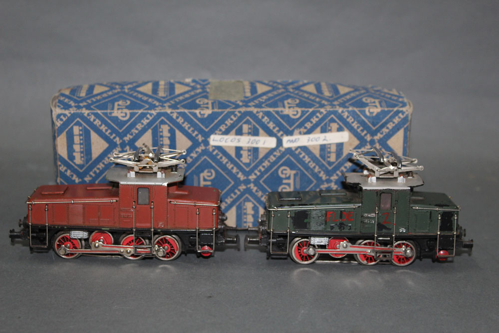 Two Marklin HO scale 0-8-0 electric locomotives, (3001 & 3002), in dark red and dark green liveries,