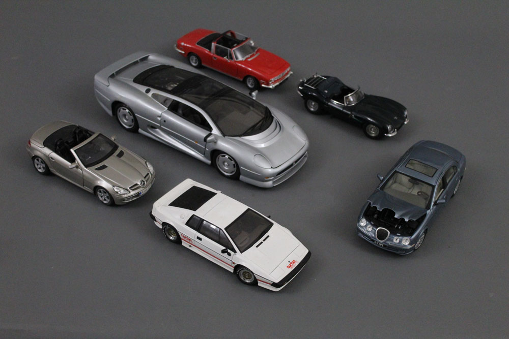 A group of six large scale diecast model cars, to comprise Maisto, Auto Art,
