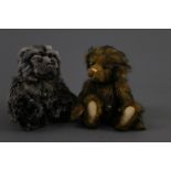 Two soft plush Charlie Bears, both with black tipped fur covered bodies,