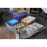 A box of vintage and modern board games and puzzles, to include Boggle, Camelot, Risk, Rummikub,