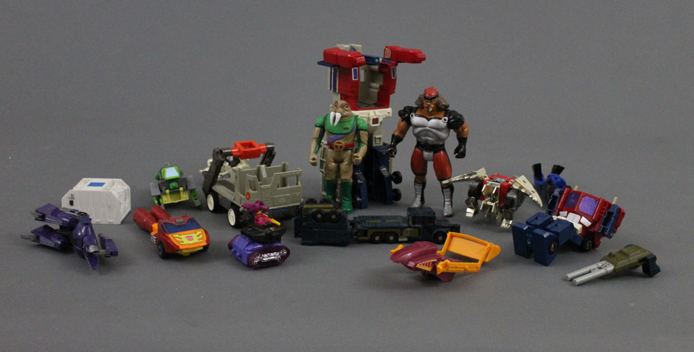 An assorted collection of 1960s-80s plastic toys, to include Venom,