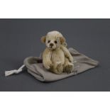 A soft plush Charlie Bears "Minimo Collection" teddy bear, named "Yo-Yo", 16 cm tall.