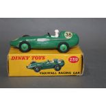 A Dinky Vanwall racing car (239), having a green body, green hubs, a white driver, a "35" decal,