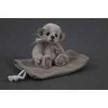 A soft plush Charlie Bears "Minimo Collection" teddy bear, named "Pocket", 18 cm tall.