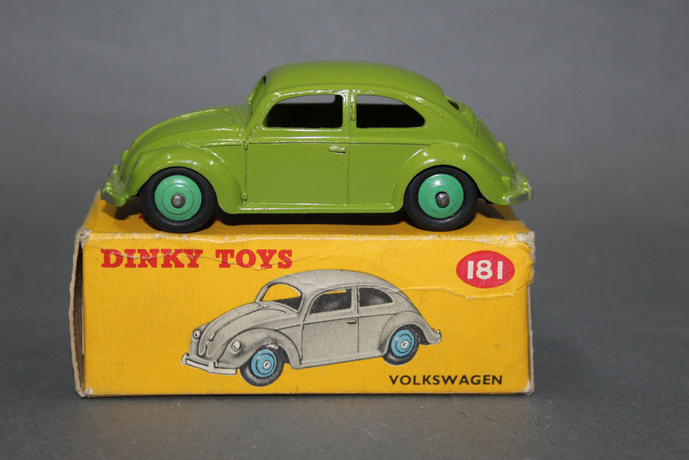 A Dinky Volkswagen Beetle (181), having a lime green body and mid green hubs,