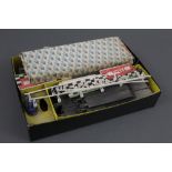 A boxed part Scalextric set, comprising hand throttles, track,