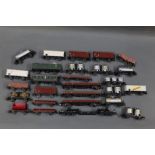 A shoebox of Marklin HO scale rolling stock and passenger coaches,