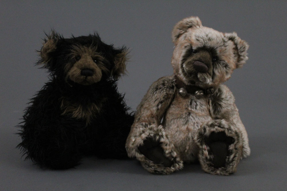 Two soft plush Charlie Bears, one with bell trimmed brown collar, the tallest measuring 32 cm.