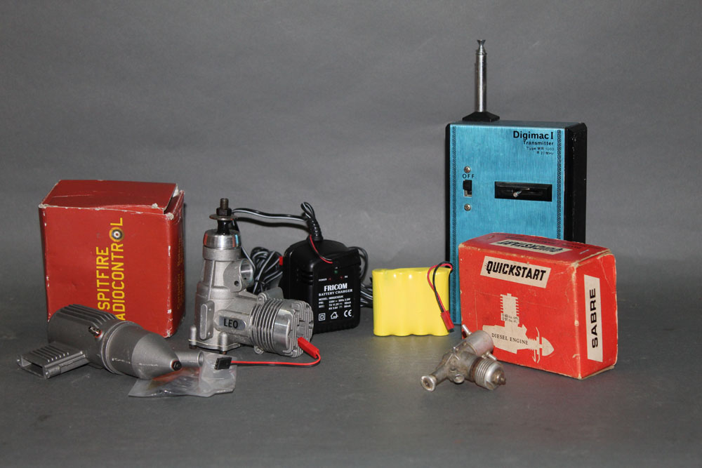 An assortment of mixed model airplane motors and accessories,