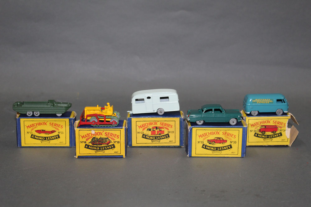 A group of five Matchbox Series diecast model vehicles,